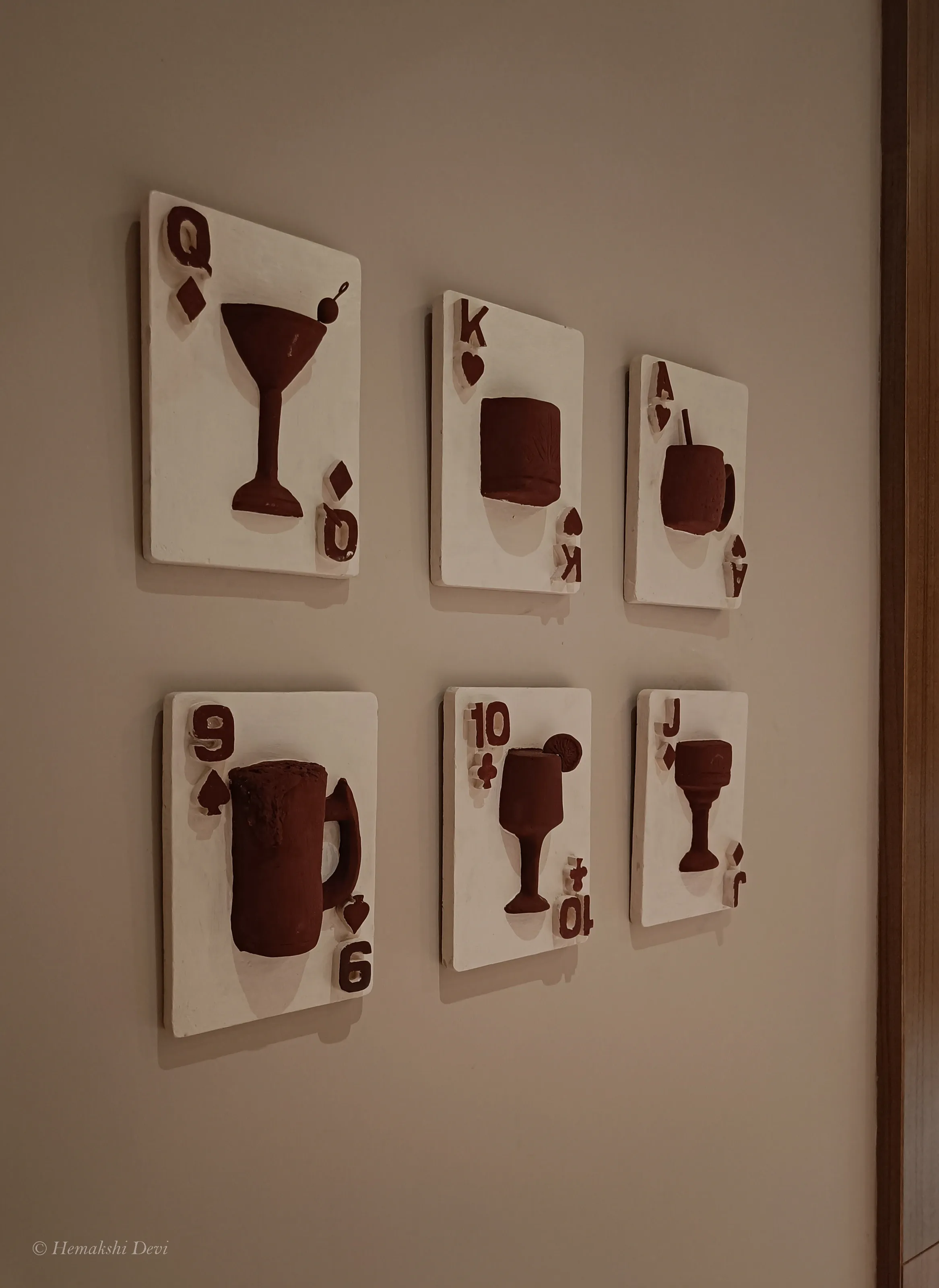 Detail of a playing-card relief on the Joha Brew bar wall